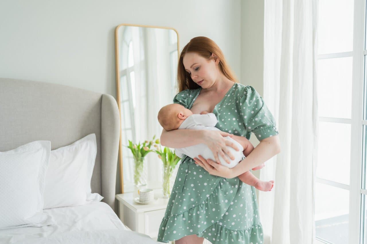 Happy Family Home Mother Breastfeeding Baby Health Nutrition Wellness Mom Nursing Feeding Her.jpg